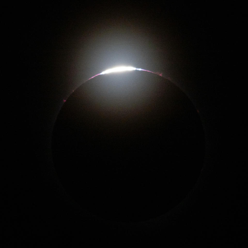 The final rays of the sun peek over the mountains of the moon in this image of the total solar eclipse on April 8