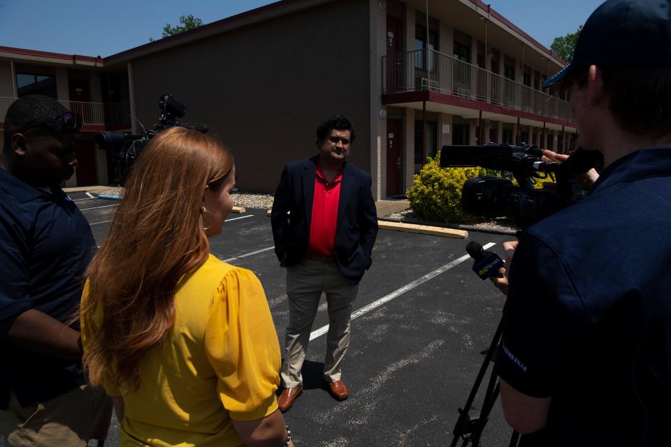 Motel 41 day manager Paul Shah gives an interview to journalists near Room 150 in Evansville, Ind., where Alabama fugitives Casey White and Vicky White were reportedly staying before being captured by local law enforcement Monday evening, May 9, 2022. 