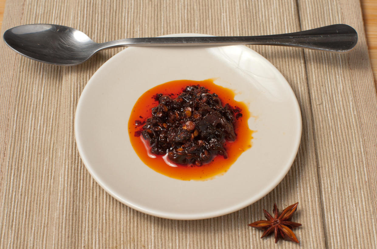 Chinese chili crisp has recently gained a cult following in the United States. Home cooks and spice enthusiasts are using it to add extra flavors to dishes like dumplings, noodles, and even ice cream. / Credit: Getty/iStockphoto