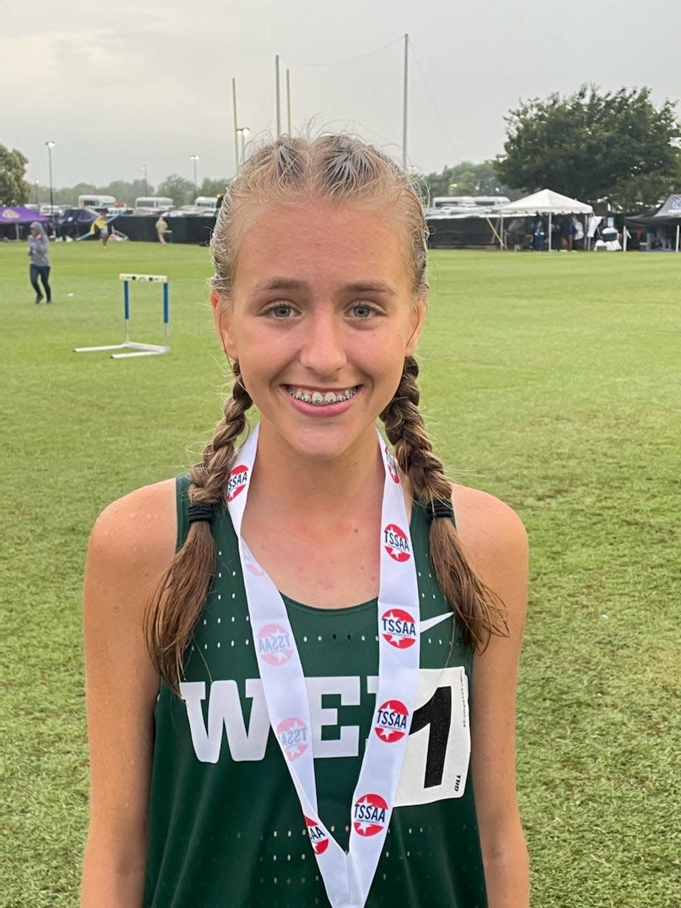 Jazzlyn Garmer of Webb poses with her medal after winning the 3,200-meter run at the TSSAA state track and field meet on May 25, 2022, at MTSU.