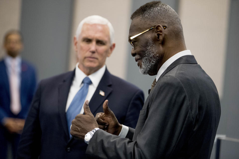 Bishop Harry Jackson gives thumbs up as he greets Vice President Mike Pence, left, who arrives to meet with community and faith leaders at Hope Christian Church, Friday, June 5, 2020, in Beltsville, Md. (AP Photo/Andrew Harnik)