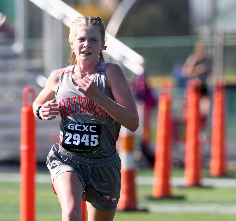 Northwest's Madelyn Begert runs to a second-place finish this year's Stark County Cross Country Championships.