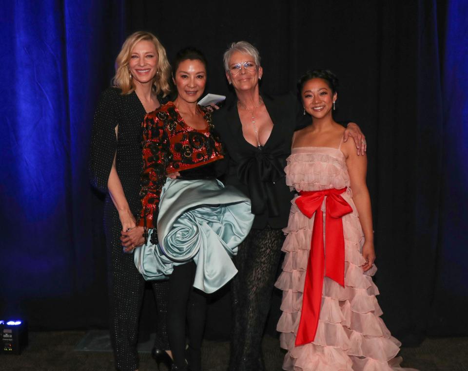 Cate Blanchett, Michelle Yeoh, Jamie Lee Curtis and Stephanie Hsu take a photo backstage at the Palm Springs International Film Festival awards gala in Palm Springs, Calif., Jan. 5, 2023.