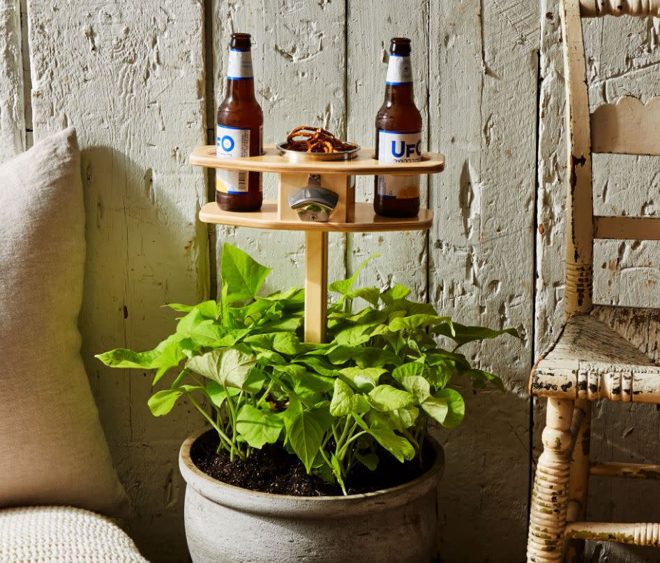 You can stick this table into the grass or one of your plants for when you're craving a midday snack. And then you can crack open a cold one when the clock strikes 5 p.m. <a href="https://fave.co/2KWemzd" target="_blank" rel="noopener noreferrer">Find it for $60 at Food52</a>. 