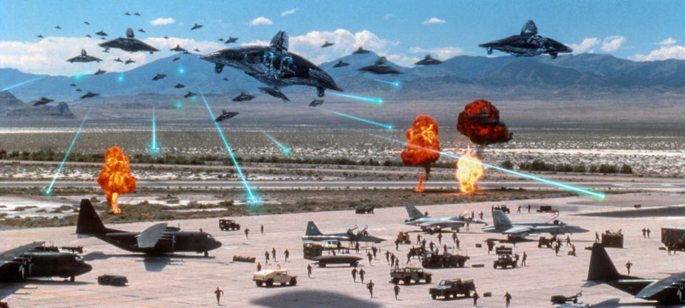 Planes lift off from an air base to fight incoming alien ships