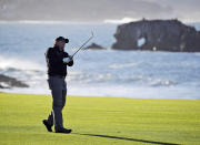 FILE - In this Feb. 11, 2019, file photo, Phil Mickelson hits from the 18th fairway of the Pebble Beach Golf Links during the final round of the AT&T Pebble Beach Pro-Am golf tournament in Pebble Beach, Calif. At Pebble Beach, a course teeming with history for Mickelson, the 48-year-old, five-time major champion will come face to face with what might be his last, best chance to win the U.S. Open and become the sixth player to complete the career Grand Slam. (AP Photo/Eric Risberg, File)