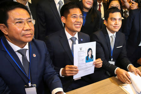 Thai Raksa Chart party leader Preechapol Pongpanich, holds up the application of candidate for Prime Minister, Thailand's Princess Ubolratana Rajakanya Sirivadhana Barnavadi, at the election commission office in Bangkok, Thailand February 8, 2019. REUTERS/Athit Perawongmetha