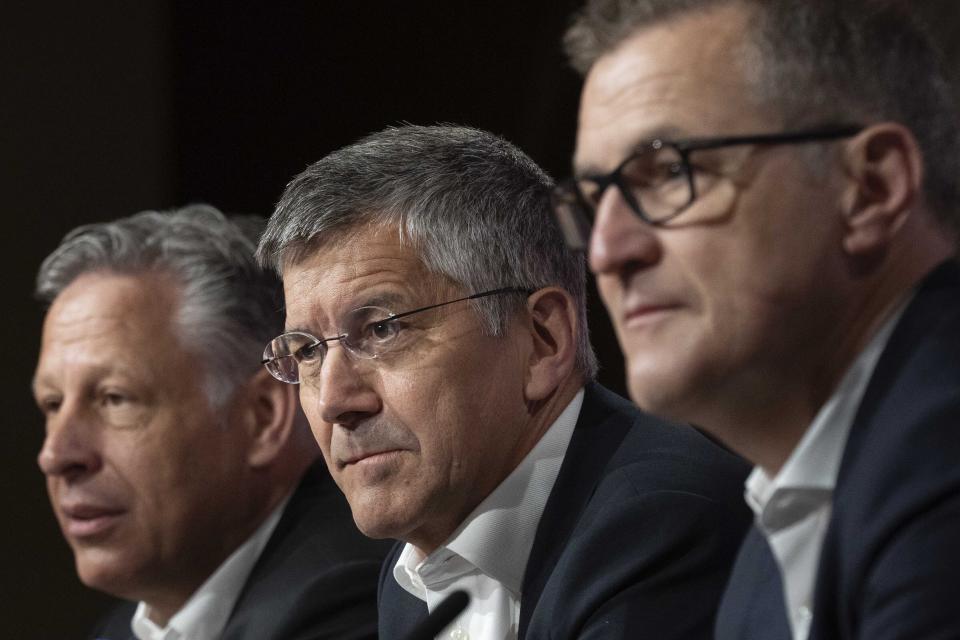 FILE - New Bayern Munich soccer club CEO Jan Christian Dreesen, foreground right, president Herbert Hainer and media director Stefan Mennerich attend a news conference in Munich, Germany, Sunday, May 28, 2023. Bayern Munich’s president has confirmed that the club is aware of “initial talks” around a reported move for forward Sadio Mané from the German champion to Saudi Arabian club Al-Nassr. Bayern president Herbert Hainer says the club has been informed about the situation. (AP Photo/Matthias Schrader, File)