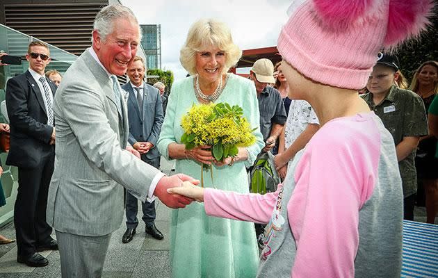 Charles and Camilla also visited a children's hospital before the opening ceremony. Photo: Getty