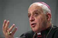 Bishop Rino Fisichella speaks during a presentation of the Evangelii Gaudium (The Joy of the Gospel) from Pope Francis, during a news conference in Vatican November 26, 2013. REUTERS/Alessandro Bianchi