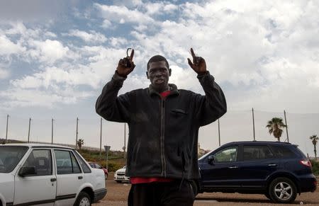 An African migrant reacts after arriving at the CETI, the short-stay immigrant centre, after crossing the border from Morocco to Spain's North African enclave of Melilla, Spain, June 26, 2016 REUTERS/Jesus Blasco de Avellaneda