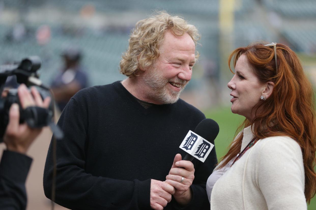 Actor Timothy Busfield interviews his wife, Melissa Gilbert, as they are filmed May 10, 2013, by a Detroit Tigers videographer before the start of a baseball game in Detroit.