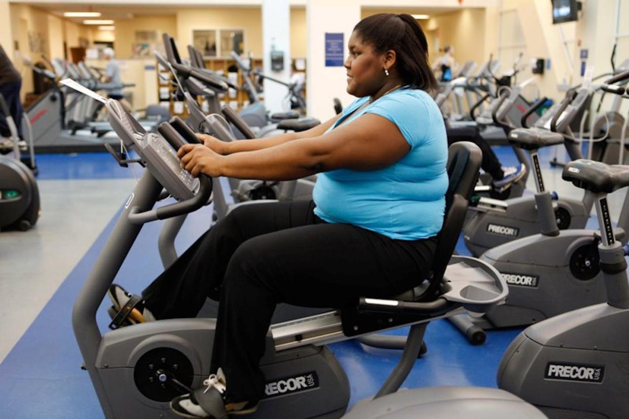 A woman exercising on a stationary bike. Exercise is an important component of weight loss, most experts agree. <a href="http://creativecommons.org/licenses/by-sa/4.0/" rel="nofollow noopener" target="_blank" data-ylk="slk:CC BY-SA;elm:context_link;itc:0;sec:content-canvas" class="link ">CC BY-SA</a>