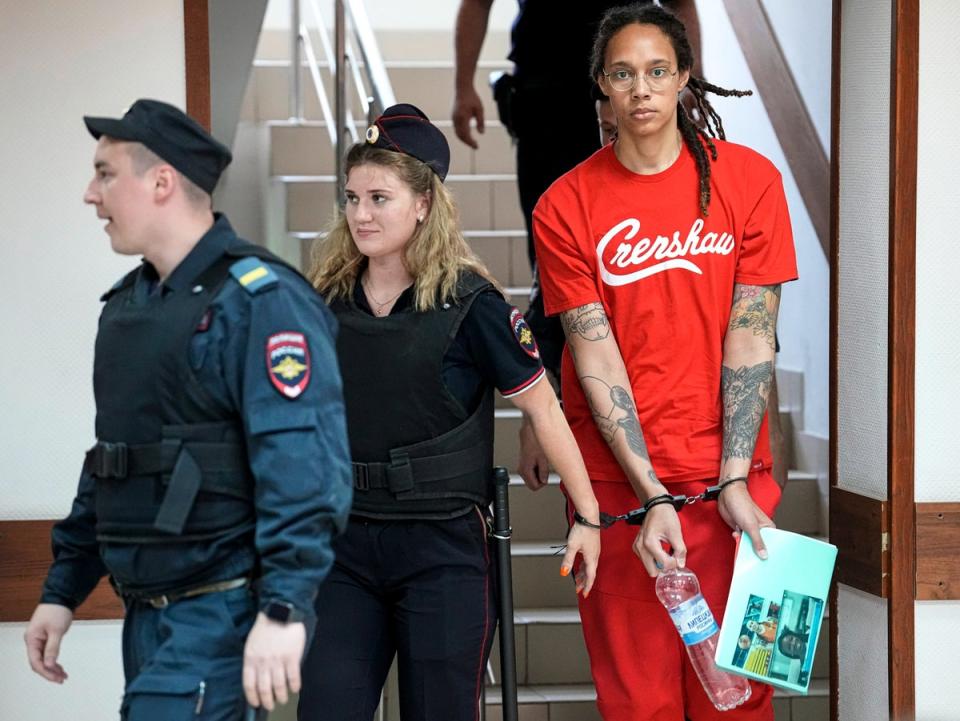 WNBA star and two-time Olympic gold medalist Brittney Griner is escorted to a courtroom for a hearing, in Khimki just outside Moscow, Russia, Thursday, July 7, 2022 (AP)