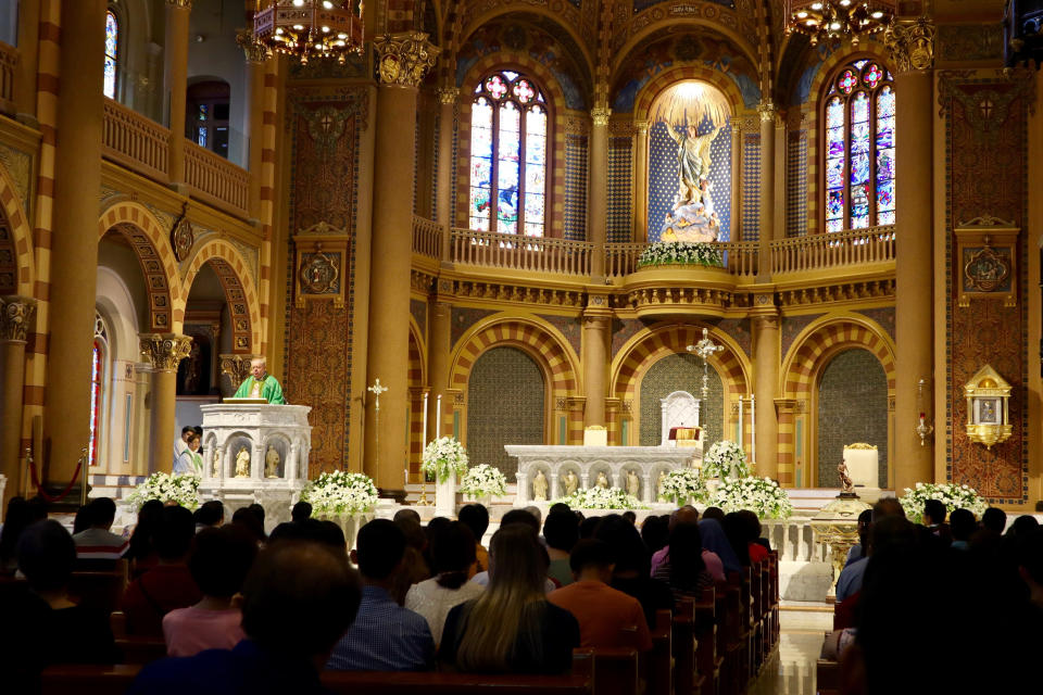 In this Sept. 8, 2019, photo, Catholic churchgoers attend a Mass in Bangkok, Thailand. The Vatican said Friday, Sept. 13, 2019, Pope Francis will visit Thailand and Japan on Nov. 19-26. (AP Photo/Kiko Rosario)