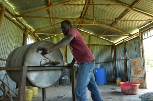 The dried skins are stuffed inside a rusty drum and drenched in an acidic herbal solution that tans them into fish leather