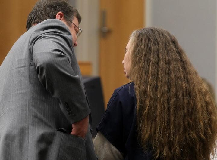 Shanna Lanham talks with her attorney, Gus Anthony, in the courtroom before pleading guilty to second-degree murder in the death of her daughter, Addison Grace Lanham, who died on July 21, 2011.