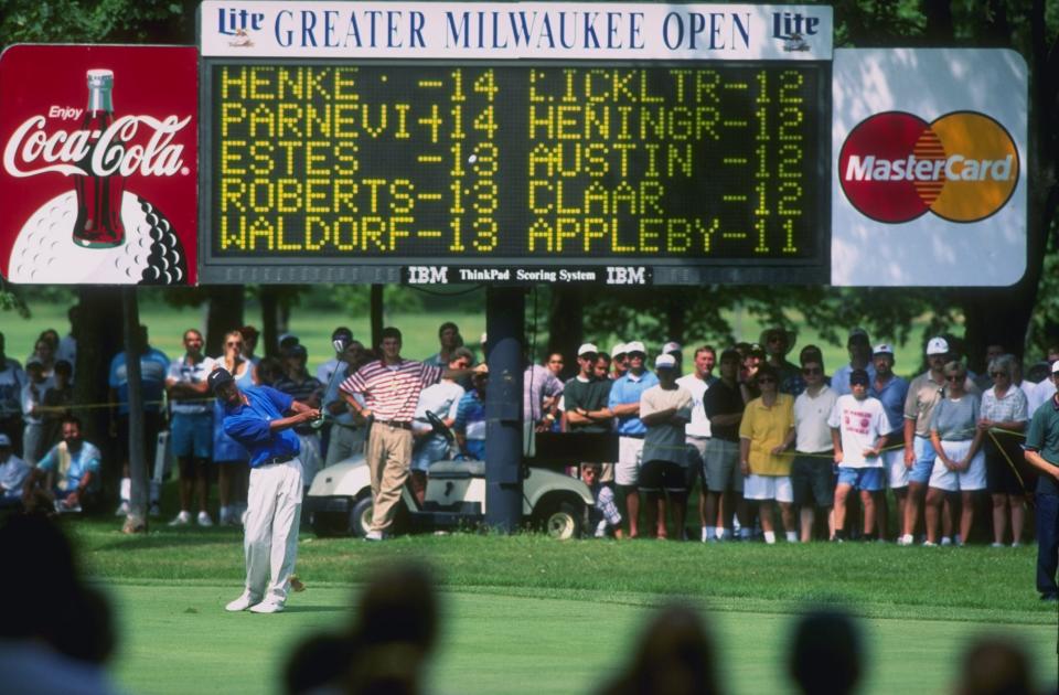 Tiger Woods plays a shot on the fairway during his pro debut at the 1996 Greater Milwaukee Open at the Brown Deer Golf Course in Wisconsin. (Photo: J.D. Cuban/Allsport)