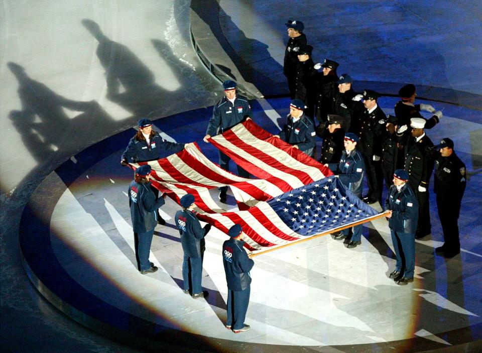 The World Trade Center flag is presented by members of the New York Police and Fire departments at the opening ceremony of the Salt Lake 2002 Winter Games at the University of Utah’s Rice-Eccles Stadium on Friday, Feb. 8, 2002. | Stuart Johnson, Deseret News