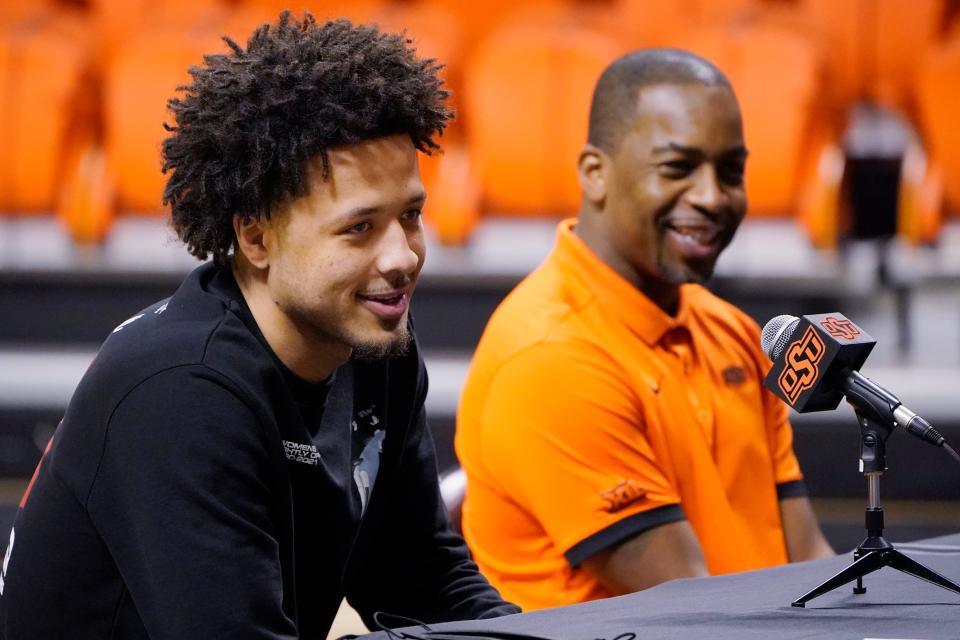 Cade Cunningham, left, and Oklahoma State head coach Mike Boynton Jr., right, announce that Cunningham will enter the NBA Draft on April 1 in Stillwater.