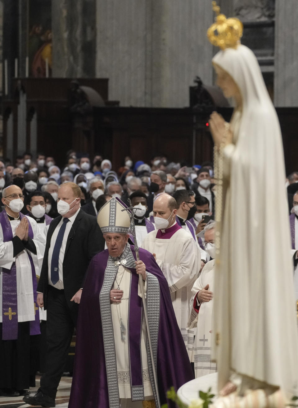 Pope Francis presides over a special prayer in St. Peter's Basilica at the Vatican, Friday, March 25, 2022. Francis is presiding over a special prayer for Ukraine that harks back to a century-old apocalyptic prophesy about peace and Russia that was sparked by purported visions of the Virgin Mary to three peasant children in Fatima, Portugal in 1917. (AP Photo/Gregorio Borgia)