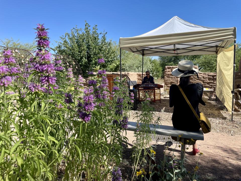 Sharon Yang listens to a Chinese traditional music performance by the Jasmine Asian Music Ensemble at Mission Garden in Tucson, May 27, 2023.