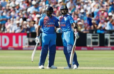 Cricket - England v India - Third International T20 - The Brightside Ground, Bristol, Britain - July 8, 2018 India's Rohit Sharma celebrates with Virat Kohli after reaching a half century Action Images via Reuters/Ed Sykes