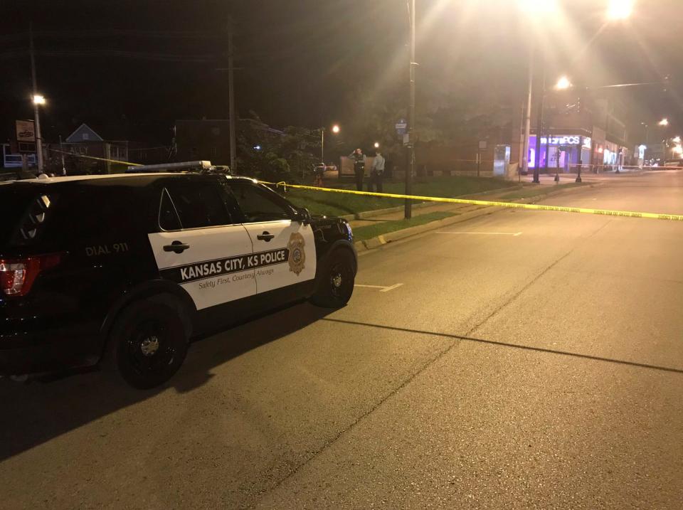 A Kansas City Police Department car is parked behind crime scene tape in October 2019.