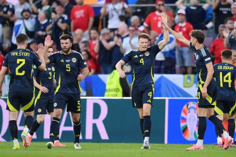 Scott McTominay and Scotland players celebrate after scoring against Switzerland at Euro 2024