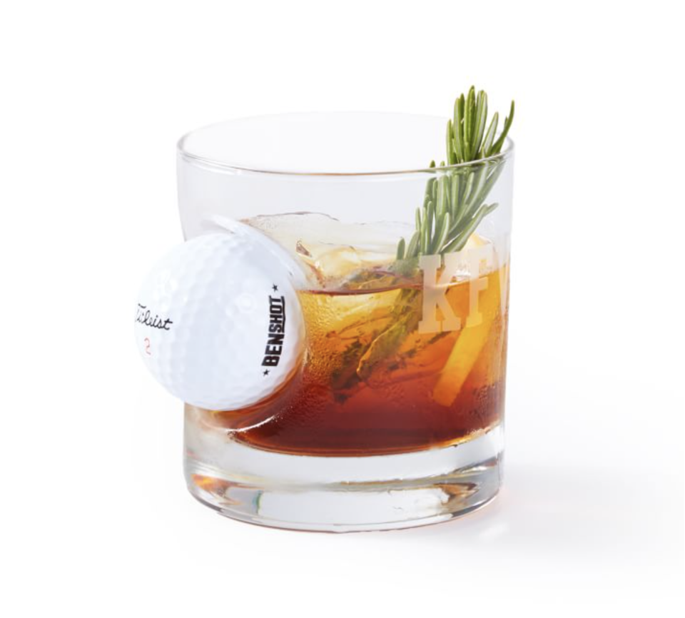 <p><strong>Mark & Graham</strong></p><p>markandgraham.com</p><p><strong>$25.00</strong></p><p>This glass combines his two loves: golf and whiskey. A real Titleist golf ball is embedded into the glass and you can customize it with a monogram, so he knows it's his.</p>