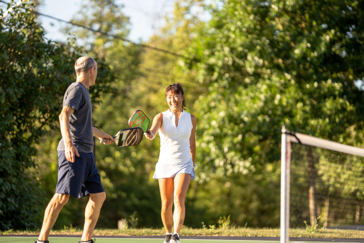 man and woman playing pickleball on court Amazon early Prime Day deal