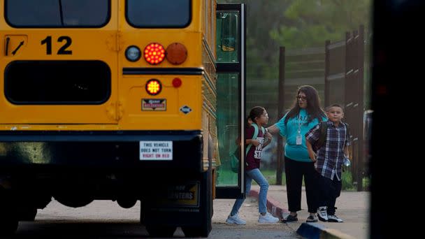PHOTO: Students arrive at Uvalde Elementary, now protected by a fence and Texas State Troopers, for the first day of school, Sept. 6, 2022, in Uvalde, Texas. (Eric Gay/AP)