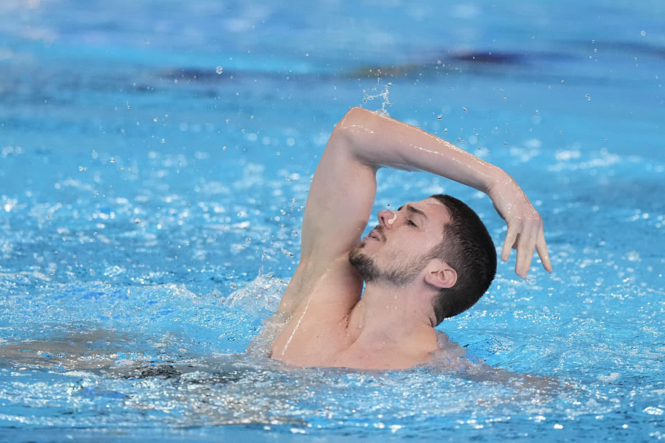 Giorgio Minisini of Italy competes in the men's solo free of artistic swimming at the World Aquatics Championships in Doha, Qatar, Tuesday, Feb. 6, 2024. (AP Photo/Lee Jin-man)