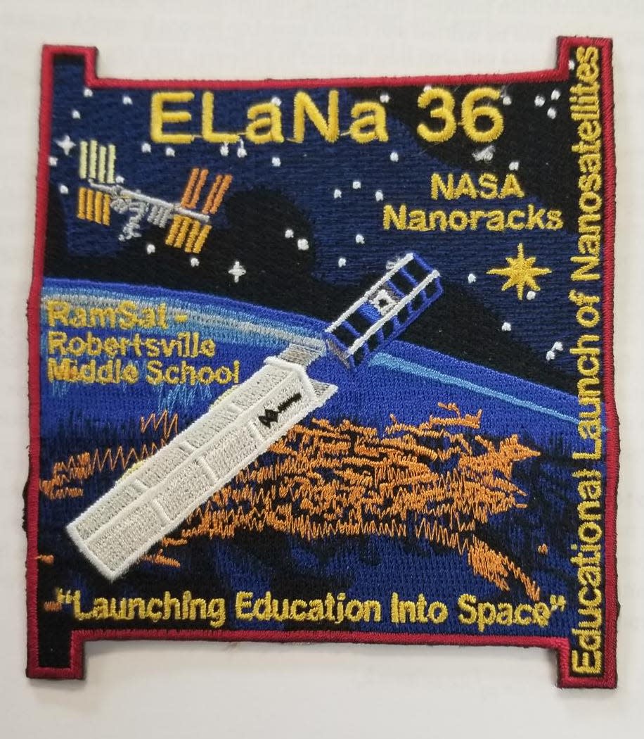 The official NASA patch for RamSat. D. Ray Smith's comment: "Quite impressive!"