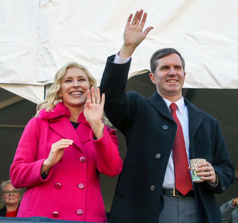Governor Andy Beshear and First Lady Britainy watch from the review stand during the inaugural parade on Tuesday, December 12, 2023