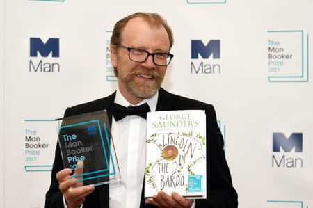 George Saunders, author of 'Lincoln in the Bardo', poses for photographers after winning the Man Booker Prize for Fiction 2017 in London, Britain, October 17, 2017. REUTERS/Mary Turner