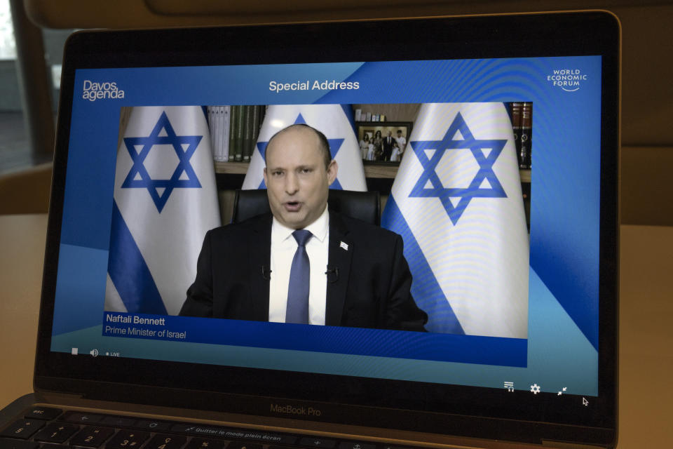 Screen shows Israeli Prime Minister Naftali Bennet (top in screens) addressing his statement during the Davos Agenda 2022, in Cologny near Geneva, Switzerland, Tuesday, Jan. 18, 2022. The Davos Agenda, from 17 to 21 January 2022, is an online edition due to the coronavirus disease (COVID-19) outbreak gather global leaders to shape the principles, policies and partnerships needed in this challenging context. (Salvatore Di Nolfi)/Keystone via AP)