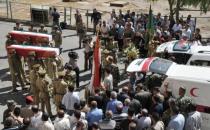 Picture from the state-run Syrian Arab News Agency (SANA) shows Syrian security forces carrying the coffins of comrades killed in violence at the Tishrin military hopsital in Damascus on June 9. The new head of Syria's main opposition group called Sunday for mass defections from a Syrian regime struggling to survive by carrying out massacres, as the death toll in the uprising topped 14,000