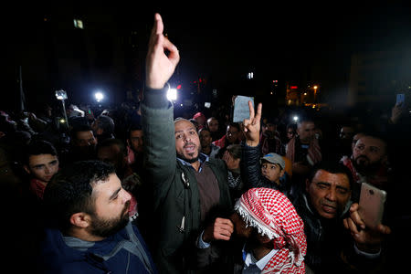 A demonstrator gestures during a protest against the government's tough austerity measures in Amman, Jordan December 13, 2018. REUTERS/Muhammad Hamed