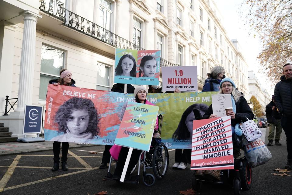 Protesters outside the inquiry (PA)