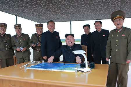 North Korean leader Kim Jong Un inspects a long and medium-range ballistic rocket launch drill in this undated photo released by North Korea's Korean Central News Agency (KCNA) in Pyongyang on August 30, 2017. KCNA/via REUTERS