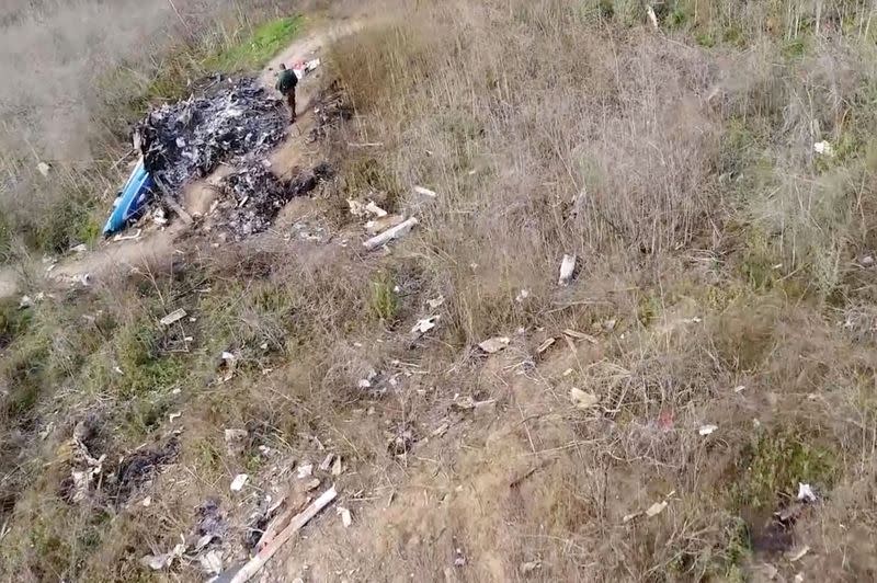 The site of the helicopter crash that killed Kobe Bryant and eight others is seen in a screen grab from drone footage