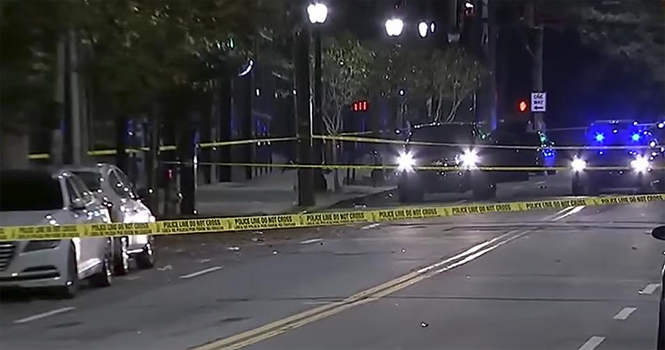 This image provided by WSB-TV shows police on the scene of a shooting that left multiple people injured in downtown Atlanta early Sunday morning, Oct. 29, 2023. In a statement Sunday, university officials confirmed that two students were among those injured in the shooting. (WSB-TV via AP)