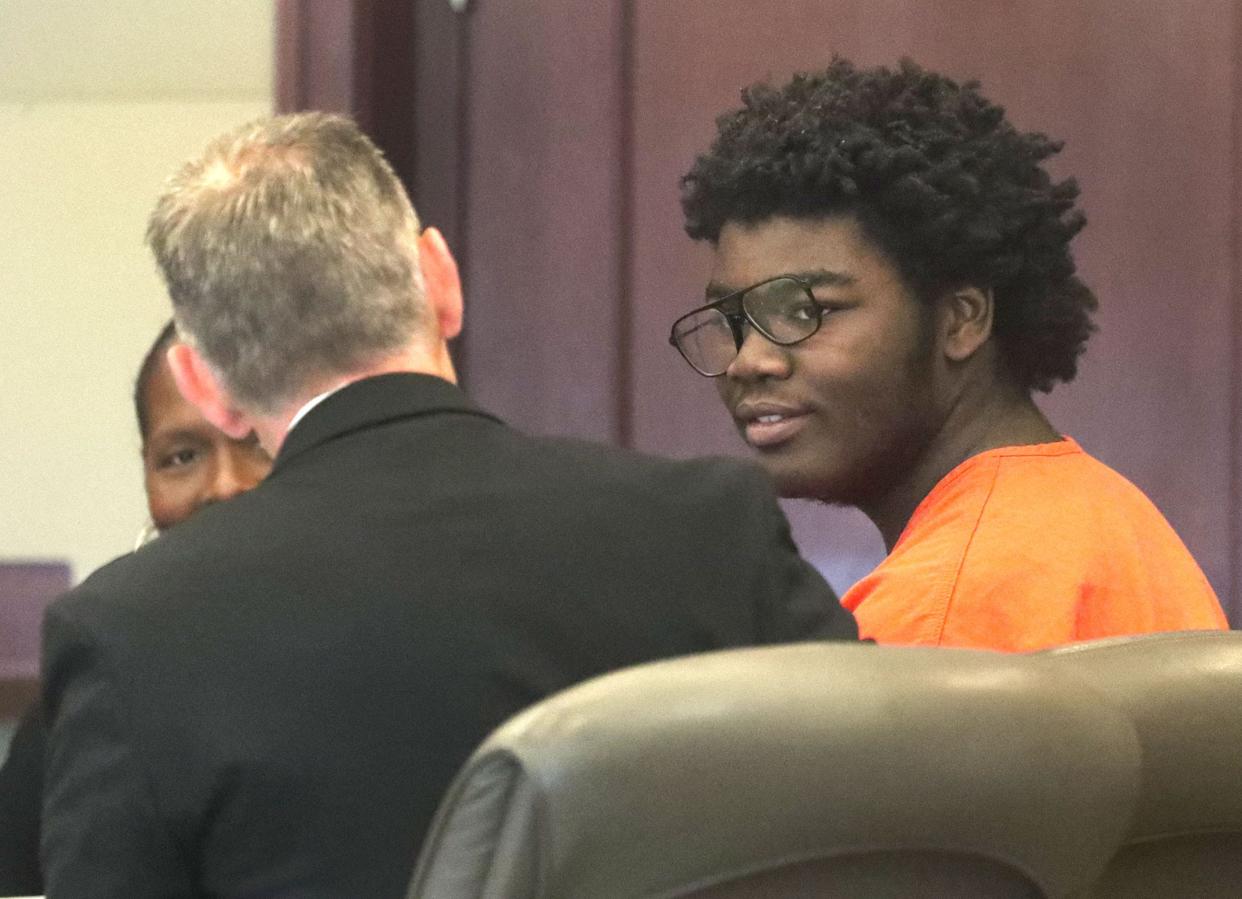 Brendan Depa talks with his defense team, Friday, June 16, 2023, before the start of his competency hearing before Circuit Judge Terence Perkins at the Kim C. Hammond Justice Center in Bunnell.