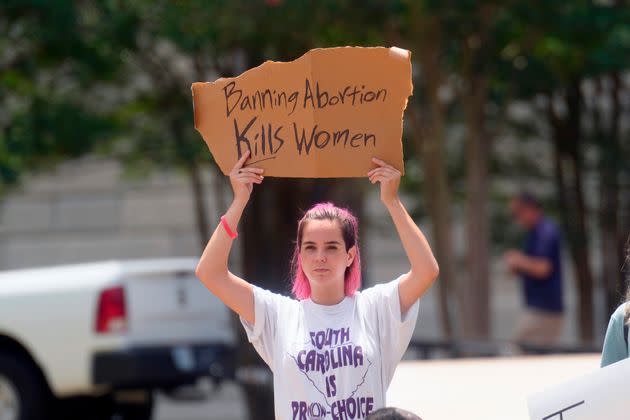 An abortions rights supporter protests outside the South Carolina statehouse Friday. A South Carolina law prohibiting abortion once a fetal heartbeat is detected, at about six weeks, had been on hold pending the Supreme Court's ruling. (Photo: Meg Kinnard/Associated Press)