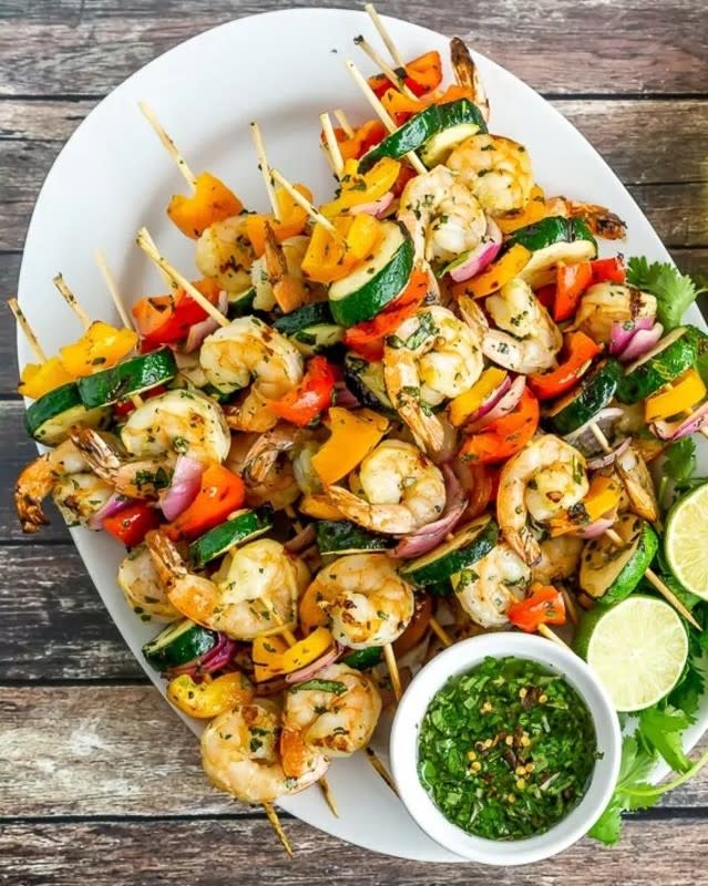 <p>The delicious sauce doubles as a marinade, giving these shrimp skewers lots of flavor without any fuss. A great healthier option for backyard grilling! <strong>Get the Recipe: <a href="https://www.babaganosh.org/grilled-shrimp-vegetable-skewers/" rel="nofollow noopener" target="_blank" data-ylk="slk:Grilled Shrimp and Vegetable Skewers;elm:context_link;itc:0;sec:content-canvas" class="link rapid-noclick-resp">Grilled Shrimp and Vegetable Skewers</a></strong></p>