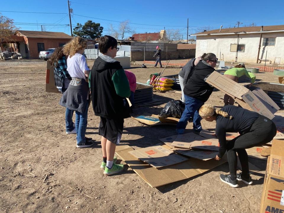 Alamogordo residents volunteer to clean up the newly renovated Dudley School after it was hit by an alleged act of arson Jan. 27.