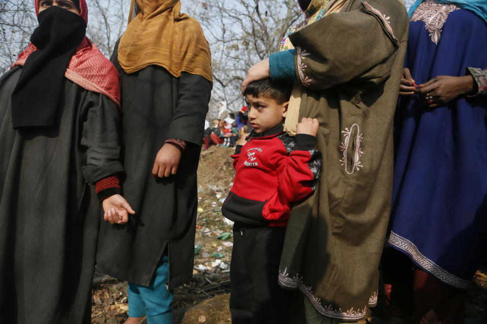 Kashmiri villagers attend the funeral of rebel Bashrat Ahmad at Shopian, south of Srinagar, Indian controlled Kashmir, Tuesday, Nov. 20, 2018. Four rebels and an Indian army commando were killed in fighting in disputed Kashmir on Tuesday, triggering anti-India protests and clashes in the restive region. (AP Photo/Mukhtar Khan)