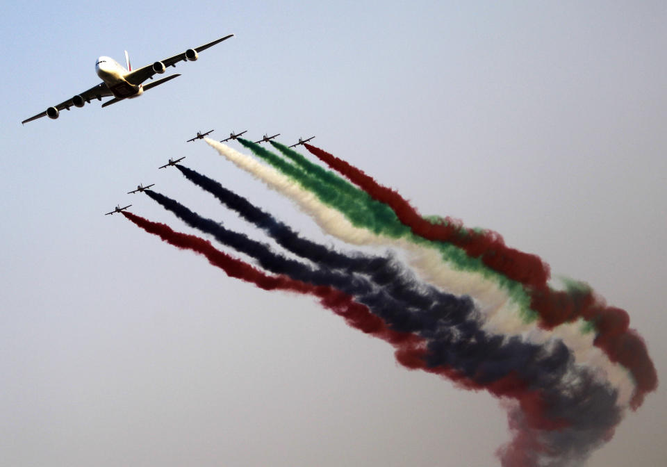 Al Fursan, the aerobatics demonstration team of the UAE Air Force perform with an Emirates Airbus 380 plane during the Dubai Airshow in Dubai, United Arab Emirates, Monday Nov. 18, 2013. (AP Photo/Kamran Jebreili)