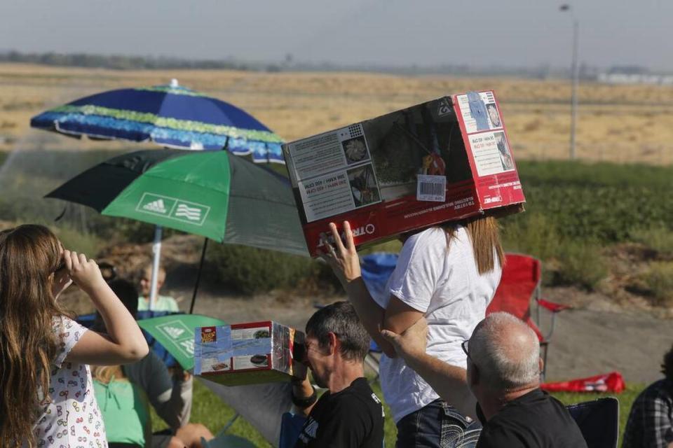 Hundreds of people gather to view the solar eclipse at the Columbia Basin College campus in Pasco.